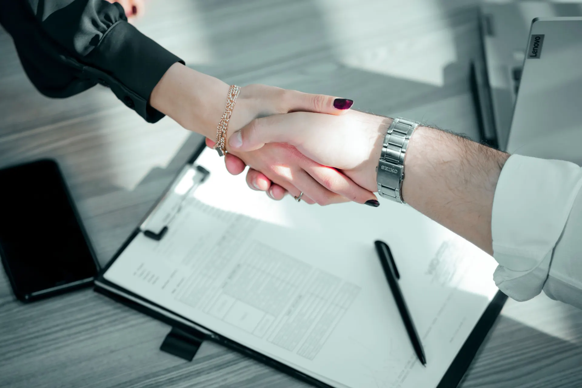 Business partners shaking hands after a successful agreement