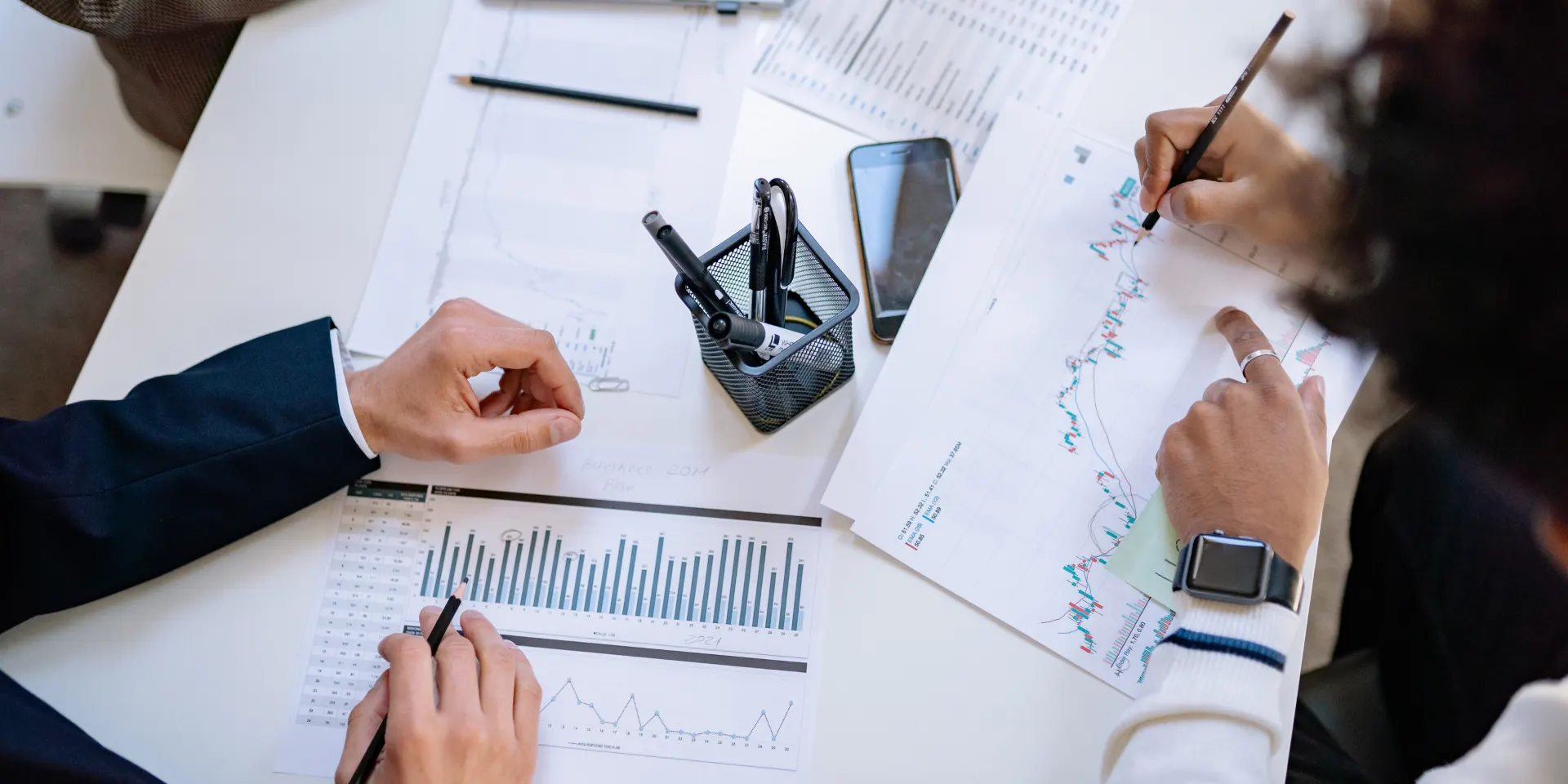Financial consultants reviewing business reports