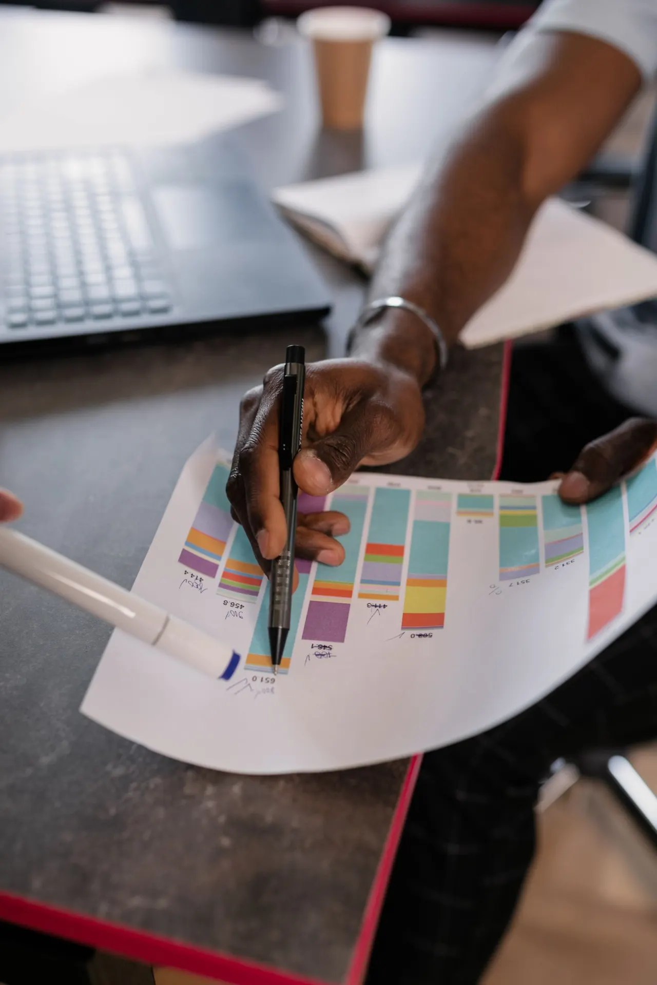 Consultants analyzing performance graphs during a strategy meeting
