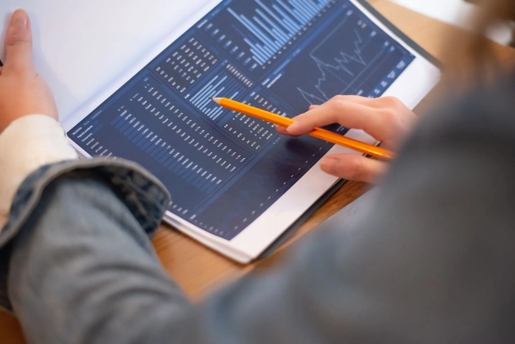 Consultant reviewing business performance charts and reports