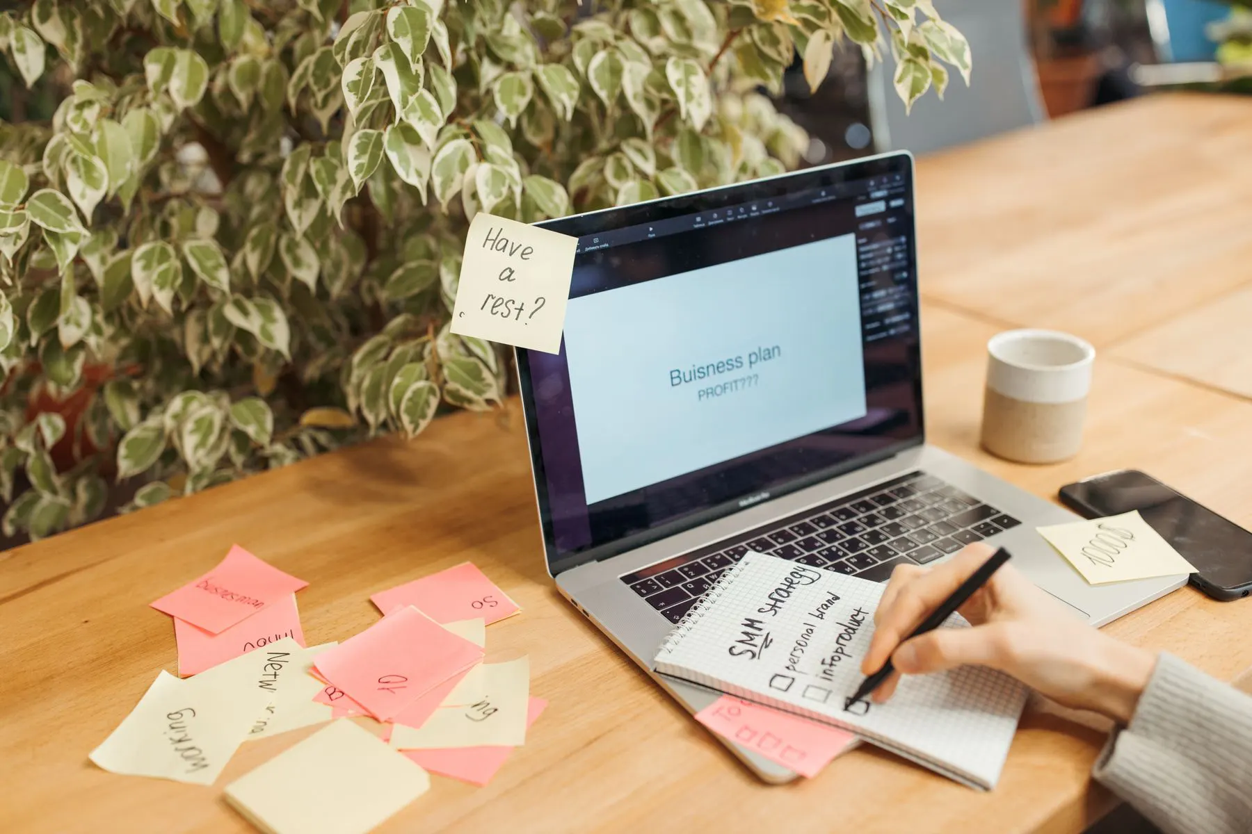 Business strategy planning workspace with a laptop and notes