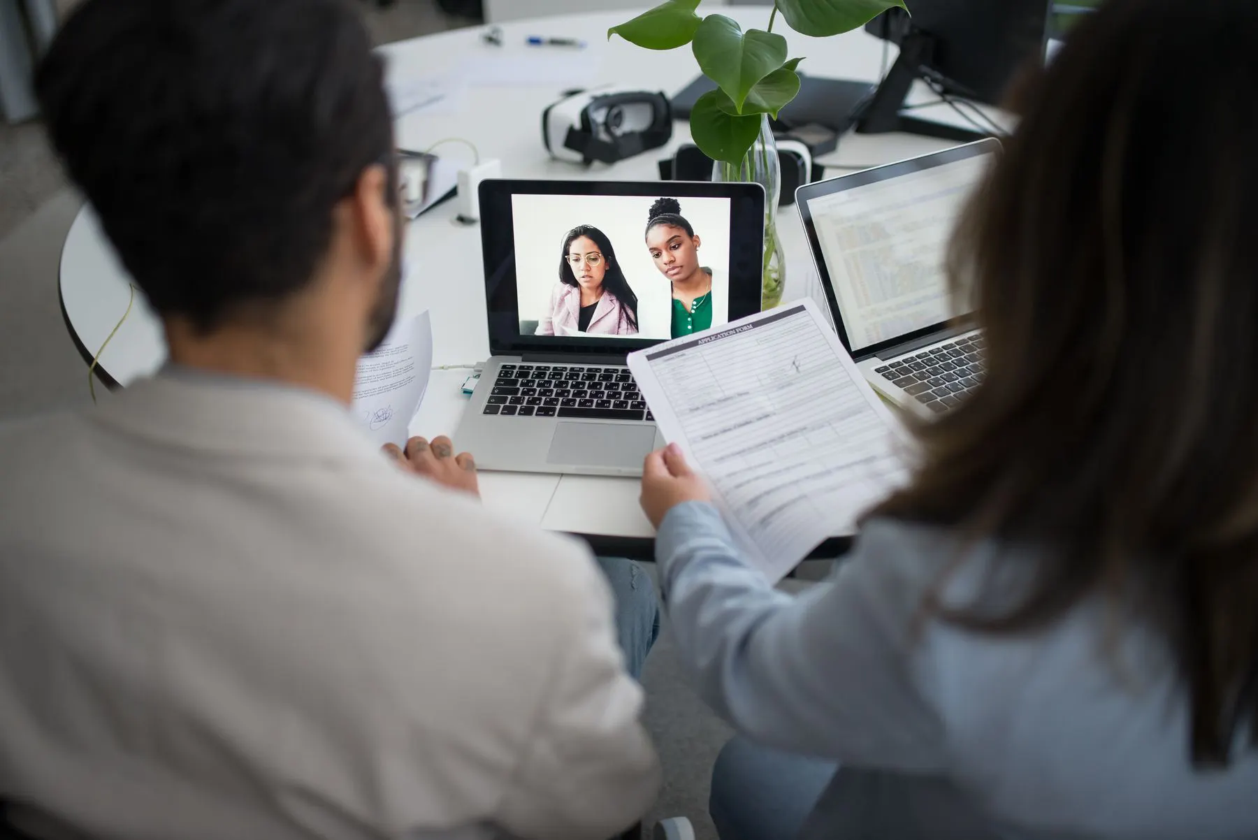 Recruiters conducting an online candidate interview