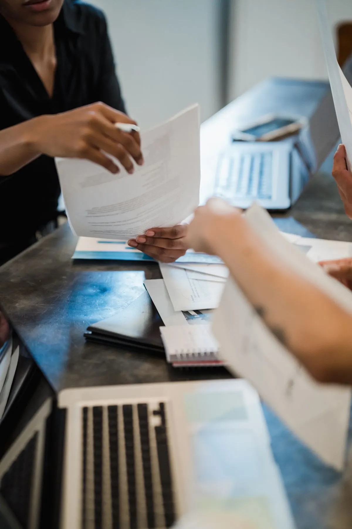 Professionals reviewing documents during a meeting